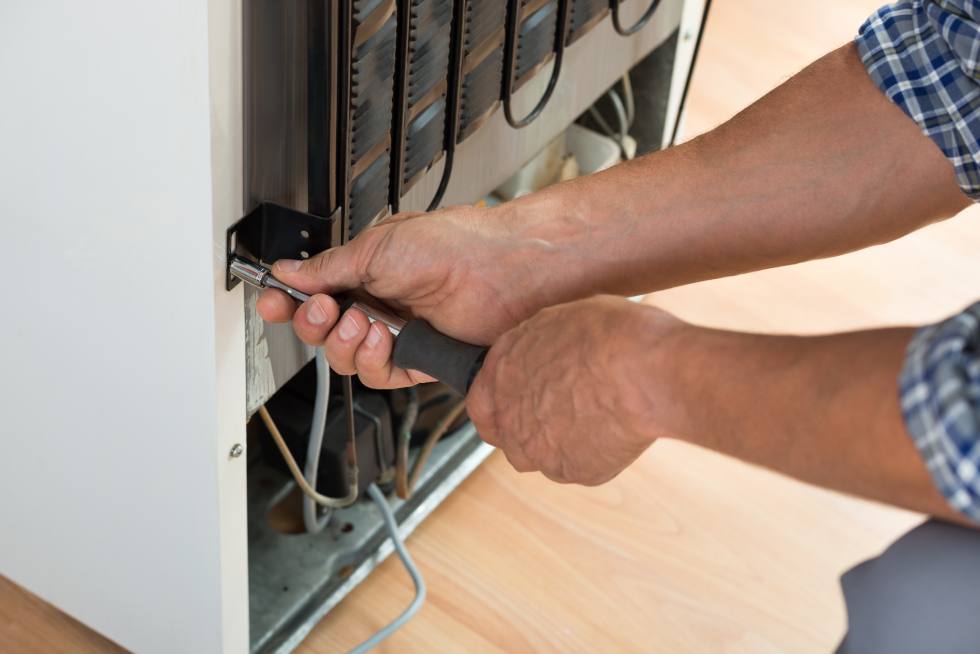 A technician fixing a machine